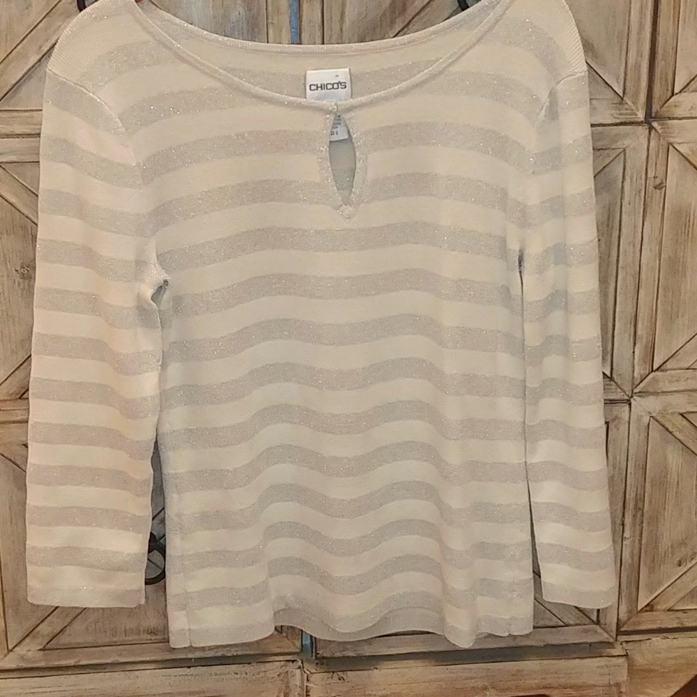 Chico's silver and white sweater with key hole.